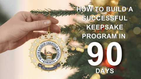 Hand placing a decorative anniversary ornament on a Christmas tree branch with text overlay about building a successful keepsake program in 90 days.